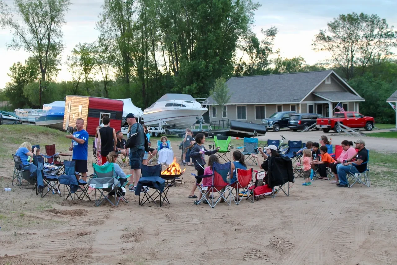 Camp Gratitude campfire gathering on the beach